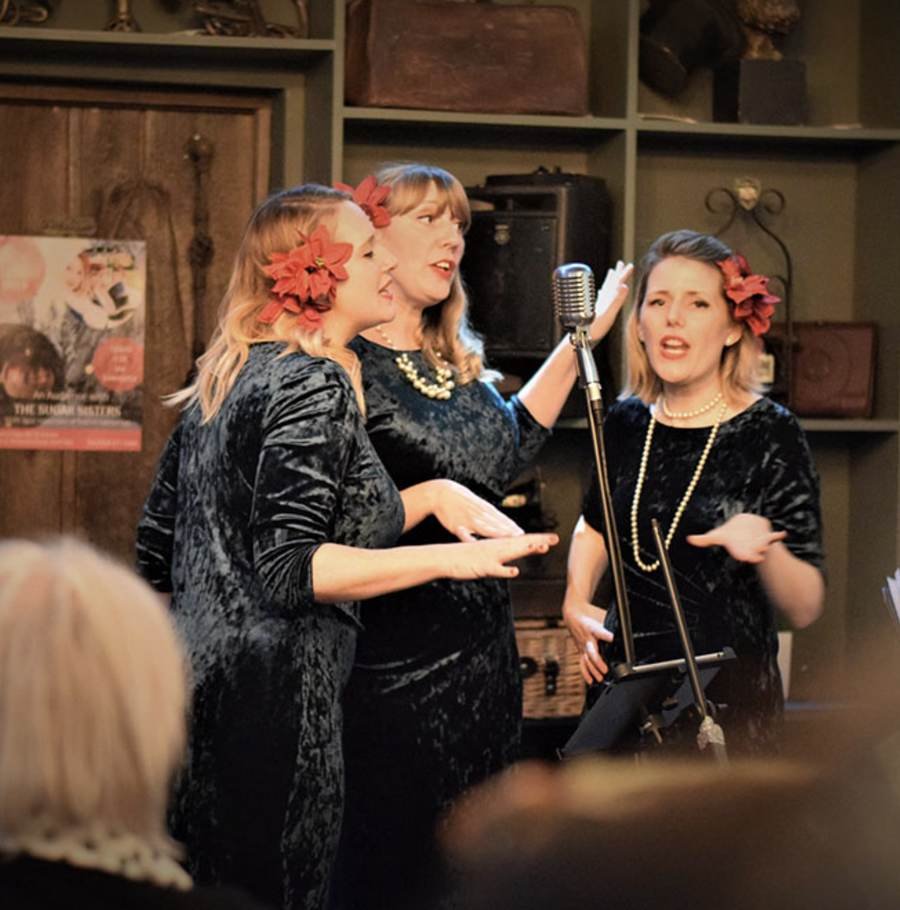 A vocal trio performing live at Park's Edge Bar and Kitchen